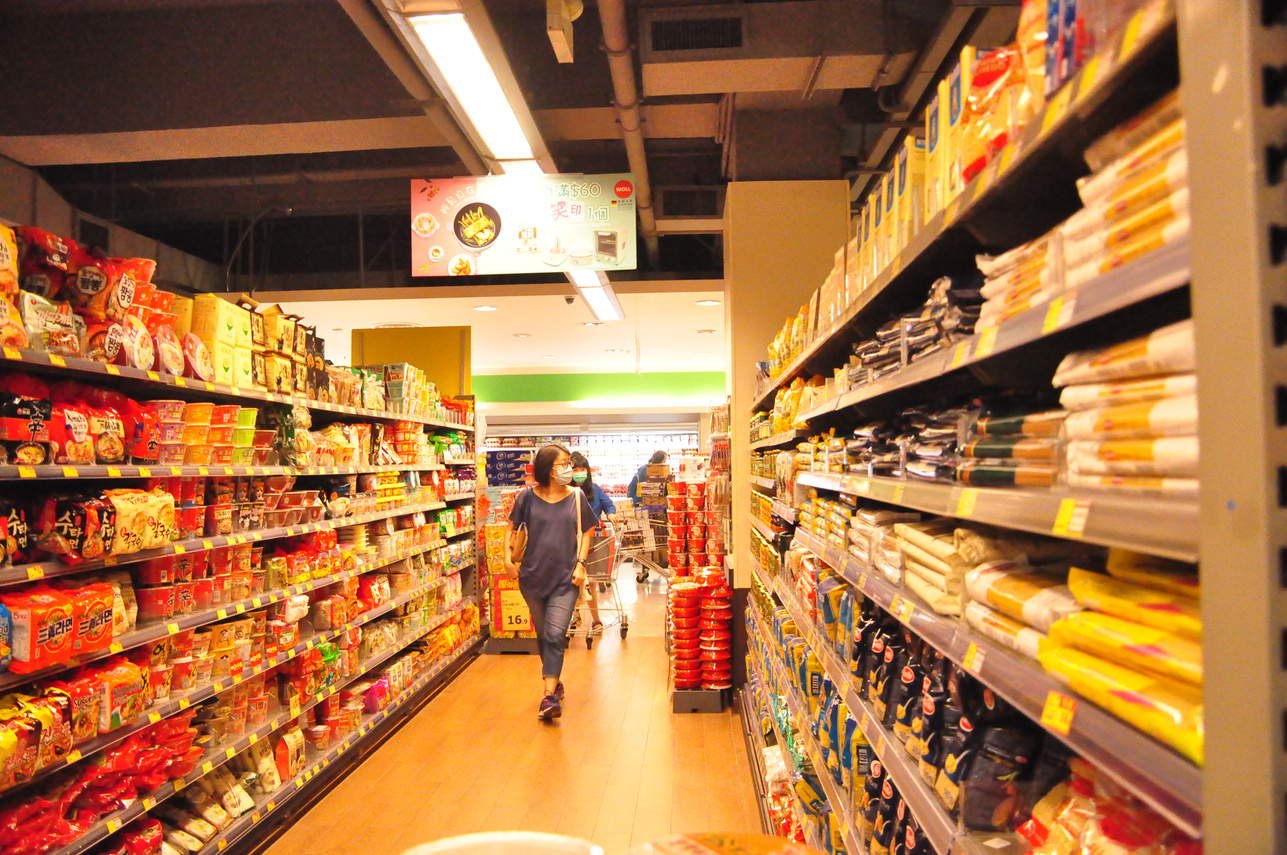 Female customer choosing products in market